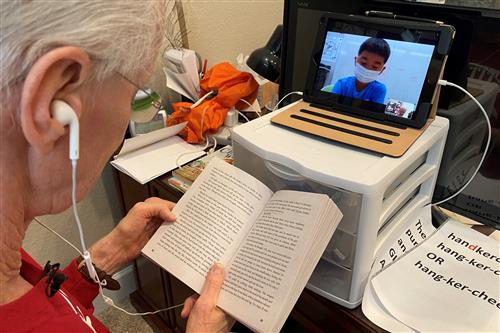 Larry Smith reading with student 